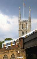 A South eastern Service for Charing Cross makes its way over Railway Approach viaduct shortly after leaving London Bridge station in June 2011. Beyond the viaduct stands Southwark Cathedral [see image 43915].<br><br>[Ian Dinmore 18/06/2011]