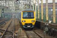 Looking towards Heaton Norris Junction (the SB can just be seen to the left of the emu) as a Northern 323 approaches Stockport with a service toAlderley Edgeon 3 October 2013.<br><br>[John McIntyre 03/10/2013]