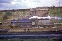 Unique amongst the 842 Black 5s built was no 44767, seen here at Kingmoor in December 1966. The locomotive left Crewe works on 31 December 1947, last day of the LMS, fitted with Stephenson valve gear (amongst a number of other features). Withdrawn at the end of 1967 it has been preserved and now carries the name <I>George Stephenson</I>. [See image 29266]. Site of Etterby Junction Signal Box behind?<br><br>[Bruce McCartney /12/1966]