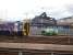 158703 stabled outside Inverness Depot on 24 June amidst much activity in the adjacent Stobart Rail facility as Tesco containers are unloaded.<br><br>[David Pesterfield 24/06/2013]
