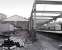 The original Haymarket train shed in the course of dismantling in late 1982 as a Waverley bound DMU waits at platform 1. Much of the structure would reappear as part of the SRPS station at Boness, while the trackbed on the right would also reappear 25 years later as platform 0 [see image 17459].<br><br>[Bill Roberton //1982]