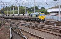 Freightliner 66551 passes Carlisle Signalling Centre on 1 October with the4S28Fiddlers Ferry - Hunterston empties.<br><br>[Bill Roberton 11/10/2013]