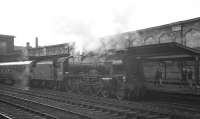 Royal Scot 46118 <I>Royal Welch Fusilier</I> has just taken over a recently arrived service at gloomy Carlisle platform 4 in August 1963. The train in question is the 8am Aberdeen - Manchester Victoria.<br><br>[K A Gray 17/08/1963]