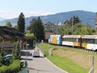MOB service train passing through Chernex on the steep descent to Montreux, which involves many twists and turns on this purely adhesion metre guage line. This is now marketed as the <I>Golden Pass Line</I>, hence the colourful livery on Ge 4/4 loco 8002 and the panoramic coaches.<br><br>[Mark Bartlett 09/09/2013]