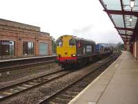 One of the class 20 powered RHTT sets at Wakefield Kirkgate following reversal near Westgate. 20304 is leading with 20312 on the rear, with the driver leaning out of his window putting on the power to run through the station heading towards Normanton.     <br><br>[David Pesterfield 18/10/2013]