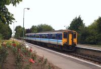 A colourful Cantley station, Norfolk, in 2003 with a Norwich - Lowestoft service arriving at the platform.<br><br>[Ian Dinmore //2003]