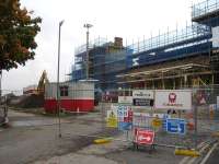 The scaffold encased east end frontage of Wakefield Kirkgate on 18 October during works which include a new ticket office, caf, offices and other facilities. The canopy along the front of the original main entrance and ticket office has been stripped back to the base support framework. <br><br>[David Pesterfield 18/10/2013]