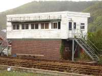 The former Machynlleth signal box, now redundant after being superceded by the ERTMS movement control system, sits moribund alongside the up line east of the station on 17 October 2013. [See image 29390]<br><br>[David Pesterfield 17/10/2013]