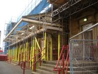 The present less than glamourous entrance to Wakefield Kirkgate is via the opening seen to the right of view. The original station entrance was into a large ticket hall, with doors at each end, located in the extended section with a canopy. The canopy has been stripped back during the station building major refurbishment being carried out from autumn 2013.<br><br>[David Pesterfield 10/10/2013]