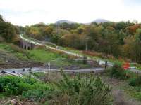 Looking south along the Black Path towards the Red Bridge at Galashiels on 24 October 2013. Beyond stands Tweedbank with the Eildon Hills on the horizon. Photographed from the temporary path recently put in place to bypass the bridge works on Winston Road [see image 42351] part of which is currently closed and inaccessible.<br><br>[John Furnevel 24/10/2013]