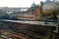 Late afternoon across the platforms at Glasgow Central from the adjacent Jurys Hotel. A class 380 has just crossed the Clyde and two classmates stand on the right.<br><br>[Malcolm Chattwood 24/10/2013]