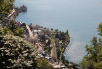 The railway runs along the full length of the north shore of Lake Geneva and at the eastern end is Chillon with its famous lakeside castle. An SBB EMU has passed the castle and its station and is heading for Lausanne, as seen from the top of the Territet Funicular at Glion. [See image 44710] for the view from below. <br><br>[Mark Bartlett 09/09/2013]