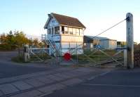 Sibsey signal box and level crossing over the B1184 roadin south Lincolnshireon the evening of 8 October 2013. The former station (closed to passengers in 1961) is out of shot to the right.<br><br>[John McIntyre 08/10/2013]