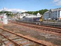 156485 photographed from the ferry terminal vehicle pre-loading waiting area as it runs into Oban with the slightly late running 15.28 arrival (12.21 ex Glasgow Queen Street) that links with the 16.00 Mull ferry. The two sidings and the former oil off-loading lines have seen little use for some time. <br><br>[David Pesterfield 17/06/2013]