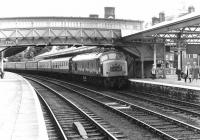 An unidentified <I>Peak</I> drifts past the kiosk on the down platform at Dumfries in July 1975 as it slowly draws to a halt with a Sheffield - Glasgow Central train.<br><br>[John Furnevel 08/07/1975]