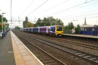 A Manchester Piccadilly to Alderley Edge service calls at Levenshulme on 3 October in the hands of Northern 323225.<br><br>[John McIntyre 03/10/2013]