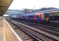 The SWT 17.01 to Waterloo makes a colourful sight at Eastleigh on a nice warm August afternoon in 2013.<br><br>[Ken Strachan 01/08/2013]