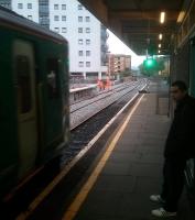 A class 150 DMU is about to leave platform 4 at Cardiff Queen Street with the 1540 Penarth - Bargoed on 31 October 2013. Part of the soon to be recommissioned through platform 5 is visible beyond the train on the left.<br><br>[John Thorn 31/10/2013]