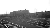 A Jubilee at the south end of Dumfries. View is south west from the locomotive shed yard towards the goods yard, complete with  a line of 'stored' steam locomotives.<br><br>[K A Gray //]