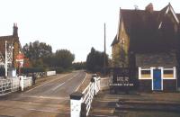 View south east over the level crossing at Millbrook, Bedfordshire, in September 1998. The station is served by trains on the Bedford - Bletchley line. The platforms are off to the left of the crossing.<br><br>[Ian Dinmore 16/09/1998]
