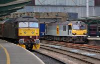 47760 at Carlisle on the rear of <I>The Statesman</I> charter from Cambridge to Fort William on 11 October 2013. Running south through platform 4 is 92039 <I>Johann Strauss</I> with the 4M63 Mossend - Hams Hall intermodal (carrying only one container).<br><br>[Bill Roberton 11/10/2013]