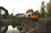 GBRF 66733 passes East Holmes SB on 7 October 2013 as it approaches Lincoln Central with a long line of bogie wagons - causing the inevitable delays at the two city centre level crossings.<br><br>[John McIntyre 07/10/2013]