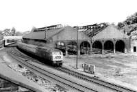 47546 restarts a Glasgow - Birmingham train from Dumfries in 1972, with demolition work well underway on the former Dumfries locomotive shed. The shed, coded 68B for most of the post nationalisation period, spent its last 4 years as 67E before final closure by BR in May 1966. Dumfries and Galloway Police HQ now occupies the site [see image 2695].<br><br>[John Furnevel 24/06/1972]