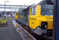 Is it just me - or do those cabs belong on two different engines? Locomotive 70008 was clearly styled by engineers - let's hope it wasn't engineered by stylists. It is shown waiting to leave platform 2 at Nuneaton Trent Valley on 31 July with a container train heading for Coventry [see image 44735].<br><br>[Ken Strachan 31/07/2013]