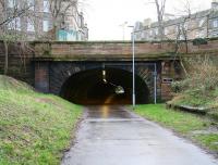 Entrance to Rodney Street Tunnel from the north in January 2013, with some of the remains of Heriothill goods on the right. At the far end is the site of Scotland Street station, followed by the longer tunnel that once took trains through to Canal Street [see image 41661].<br><br>[John Furnevel /01/2013]
