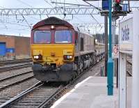 66165 is about to run through Carlisle Station on 11 October 2013 with a ballast train from Shap Quarry.<br><br>[Bill Roberton 11/10/2013]