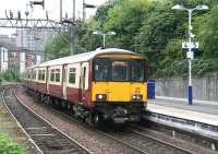 The Sunday 14.41 Balloch - Partick runs into platform 4 at Dalmuir station on 9 September 2012.<br><br>[John Furnevel 09/09/2012]