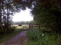 Gateway to a slower journey - looking in the opposite direction to the signal box [see image 44929], a leisurely walk around the bay on the former line to Hincaster awaits explorers.<br><br>[Ken Strachan 29/07/2013]