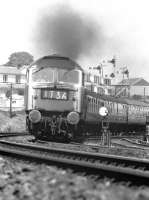 Rounding the curve at Ferryhill Junction in June 1974, a Brush Type 4 approaches the viaduct over the River Dee with an Aberdeen to Glasgow service.<br><br>[John McIntyre 08/06/1974]