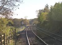View south from the level crossing at Park South, Cumbria. The<br>
double track line ahead is the 'Barrow cut off' direct<br>
line to Dalton Junction [See image 11905], which carries freight to and<br>
from Sellafield and the occasional special. On the right is the now singled route to Barrow in Furness used by Cumbrian Coast Line passenger services. [With thanks to Mike Gibb]<br><br>[Mark Bartlett 04/11/2013]