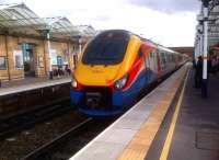 Sunglasses recommended: the 1405 to Nottingham shows off its colours at Loughborough on 25th October. The leading power car seems to have recently dispatched an unfortunate bird.<br><br>[Ken Strachan 25/10/2013]