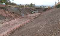 Looking south at the site of the new Eskbank station on 13 November 2013. The Tesco Hardengreen superstore is off to the right of the picture and Hardengreen roundabout is just over half a mile beyond the end of the present cutting. The end of the cutting marks the site of the filled in bridge waiting to be replaced. [See image 47531]<br><br>[John Furnevel 13/11/2013]