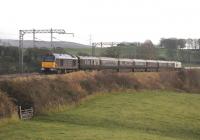 DBS 67006 <I>Royal Sovreign</I> heads the Royal Train north through open countryside near Bay Horse as part of a visit by HM The Queen to the North West of England on 14 November 2013. Silver liveried 67026 brings up the rear. <br><br>[Mark Bartlett 14/11/2013]