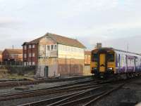 The last surviving Blackpool signal box, L&YR built North No.2, is looking decidedly shabby but will disappear with the forthcoming electrification and so is unlikely to be spruced up. Northern <I>Movember embellished</I> Sprinter 150206 approaches the platforms at Blackpool North on a sunny morning in November 2013. <br><br>[Mark Bartlett 13/11/2013]