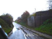 Piers and wing walls from the former overbridge that crossed the Audlem to Market Drayton road on the line linking Nantwich and Market Drayton, closed in 1967.<br><br>[David Pesterfield 14/11/2013]