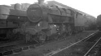 The busy shed yard at Crewe South plays host to Stanier 2-6-0 no 42963 in October 1961, having been reallocated there from Crewe North a month earlier. The locomotive ended its days at Springs Branch, Wigan, from where it was eventually withdrawn in July 1966. 42963 was cut up at Drapers of Hull in January 1967 [see image 21784].<br>
<br><br>[K A Gray 01/10/1961]