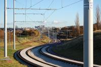 Looking east along the tram route towards Balgreen on 19 November 2013. Carrick Knowe golf course is on the left, the main line with a passing 334 on the right and Edinburgh Castle dominating the skyline.<br><br>[Bill Roberton 19/11/2013]