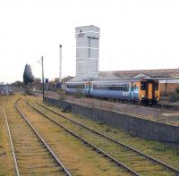 A northbound service arrives at North Walsham in October 2006, seen from the old goods yard.<br><br>[Ian Dinmore /10/2006]