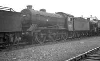 J39 0-6-0 64880 in the stored locomotives sidings alongside Gorton shed in August 1962.<br><br>[K A Gray 10/08/1962]