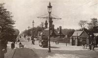 The street level station buildings at Botanic Gardens can be seen beyond the tram on Great Western Road. The building has been said to have something of the Kremlin about it. The view looks west with Byres Road off to the left. Running east from here the railway is below the road until Kelvinbridge. Reliable Series postcard.<br><br>[Ewan Crawford Collection //]