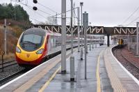 The 12.00 Glasgow - London Pendolino passes 380101 at Carstairs on 26 November 2013. The latter is on an Edinburgh Waverley - Glasgow Central working.<br><br>[Bill Roberton 26/11/2013]