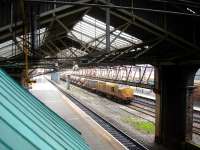 Grab shot from the footbridge at Chester as 97304 tails an RHTT working passing east through the station on the afternoon of 26 November 2013. 97302 is leading at the far end.<br><br>[David Pesterfield 26/11/2013]