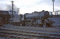 WD Austerity 2-8-0 no 90386 stands on Dunfermline shed on 30 March 1964. The S&D line via Dunfermline Upper ran past at a higher level on the north side of the depot. [See image 23038]<br><br>[John Robin 30/03/1964]