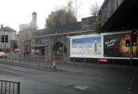 This is a view of the Cathcart Circle bridge (right) and removed but later Lanarkshire and Ayrshire Railway bridge (left). The arch now houses <I>Beechings Bar</I>, seen here on 30 November 2013 looking north west across Clarkston Road.<br><br>[John Yellowlees 30/11/2013]