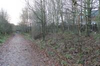 The site of Bearpark station, on the Consett to Durham line which closed to passengers in 1939. Freight trains, including those serving nearby Bearpark Colliery, continued until the 1960s when the tracks were lifted. A trackbed cyclepath now passes the site but all trace of the small station has gone. View south east towards Durham on a wet and gloomy November morning in 2012.  <br><br>[Mark Bartlett 27/11/2012]