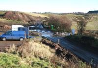 The view south at Borthwick Bank on Sunday 1 December 2013, with the Waverley formation curving to the right towards Tynehead. The amount of earth moving involved here can be ascertained from the size of the mound in the background being scaled by the tipper truck. <br><br>[John Furnevel 01/12/2013]